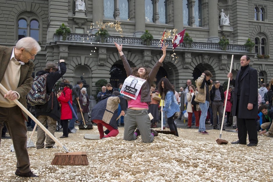 Opponents of the Swiss Basic Income Initiative demonstrate in front of parliament
