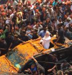 The Modimobile is making the rounds amid a flower shower. [PT] Photo credit: PTI Photo