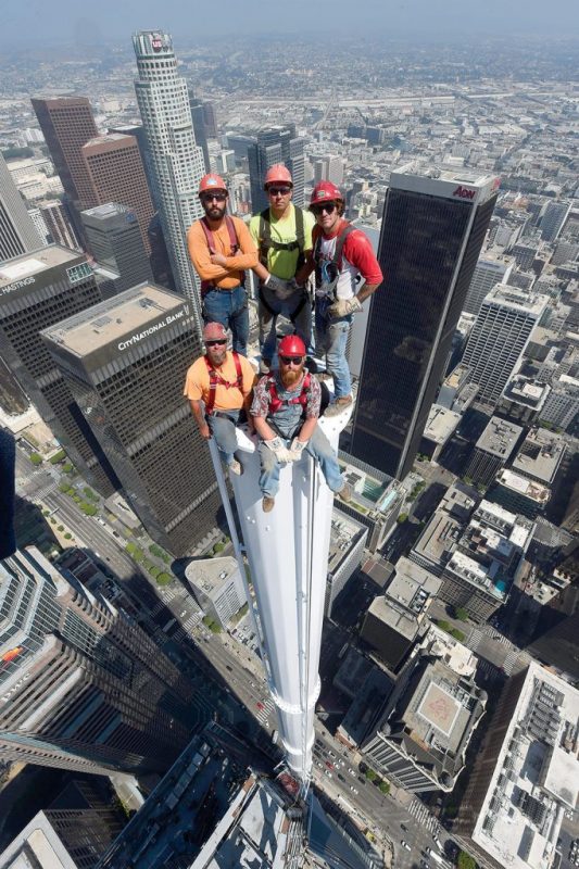 Iron workers (the non-distraught variety) atop the 10 ton spire of the Wilshire Grand Center in Lost Angeles.