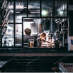 Restaurant kitchen through window workers chef working cooking moody beer bar dining (source Envato)